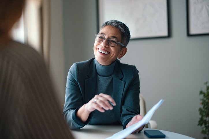 Professional Woman Engaging in a Business Meeting at the Office